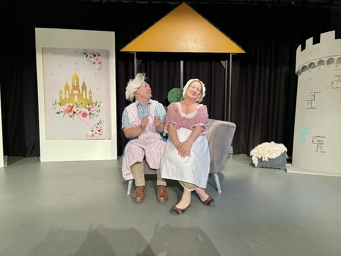 Simon on the left is playing one of Cinderella's evil step-sisters whilst Gemma on the right is playing Cinderella. 